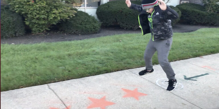 Child jumping in musical obstacle course